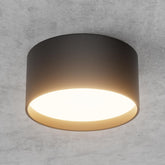 Ceiling light fixture on a gray concrete wall